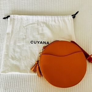 Cuyana round leather crossbody shoulder bag, in warm orange